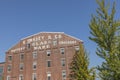 Facade of historic brick building with advertising for Swasey Pottery, Glassware and Crockery in Portland, Maine, USA