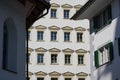 Facade of a historic building with rows of windows.