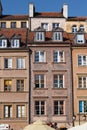 Facade of historical buildings in Old town market square in Warsaw, Poland Royalty Free Stock Photo
