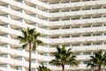 Facade  hotel or apartment building palm trees Royalty Free Stock Photo