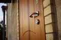 Facade of a house with a brown closed modern door