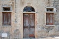 Facade of a house with an old door in Lumio Corsica France Royalty Free Stock Photo