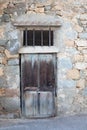 Facade of a house with an old door in Lumio Corsica France Royalty Free Stock Photo