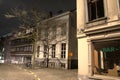 Facade of a house with shadow of a bare tree at night in Ghent