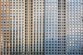 Facade of a huge multi-storey residential complex. Lots of identical windows. Texture or background