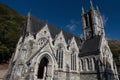 Facade of Kylemores Neo Gothic Church against a blue sky Royalty Free Stock Photo