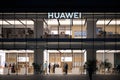 Facade of large HUAWEI flagship store at night