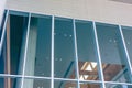 facade large windows of modern business office building in metropolitan. hall shopping mall glass window design