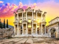 Facade of library of Celsus in Ephesus under yellow dramatic sky Royalty Free Stock Photo