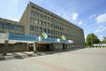 Facade of the main building of Uzhgorod National University, main entrance, Ukrainian flags. Uzhgorod, Ukraine