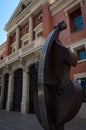 Facade of the main theater of Castellon de la Plana with the sculpture of a cello at the entrance, Spain