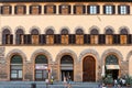 Facade of medieval house with traditional wooden shutters in Florence city, Italy Royalty Free Stock Photo