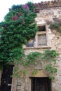 Facade of a medieval house with two stained glass windows Royalty Free Stock Photo