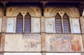 Facade of medieval palazzo, decorated with frescoes in Florence