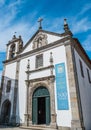 Caminha PORTUGAL - 3 August 2021 - Facade of Mercy Church with Renaissance entrance portal and door open Royalty Free Stock Photo