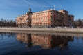 The facade of the Mikhailovsky engineers` castle and the river Moika in Saint-Petersburg