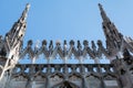 Facade of Milano cathedral famous for its numerous statues on steeples