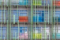 The facade of a modern building, an abstract architectural solution, multi-colored transparent panels and metal tubes in the Royalty Free Stock Photo