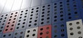 Facade of a modern building. Red, blue and white slabs or metal profiles with decorative holes Royalty Free Stock Photo