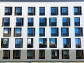 Facade of Modern Building. Reflection of Blue Sky in Windows Royalty Free Stock Photo