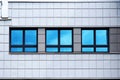 Facade of modern building. Reflection of blue sky in windows Royalty Free Stock Photo