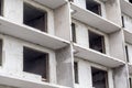 Facade of a modern building under construction. Multi-storey residential building under construction. Construction concept. Close