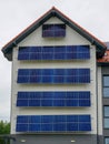 Facade of Modern Building with Vertical Solar Panels Installed for Sustainable Energy Use Royalty Free Stock Photo