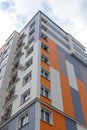 The facade of a modern building in which people live in apartments in the city center. modern new construction Royalty Free Stock Photo