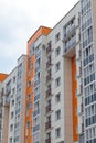 The facade of a modern building in which people live in apartments in the city center. modern new construction Royalty Free Stock Photo