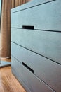 Facade of modern chest of drawers without handles Royalty Free Stock Photo