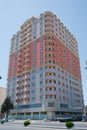 Facade of modern multi-storey new residential orange building near BAku . New apartment house . Storey houses modern . High rise Royalty Free Stock Photo