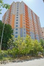 Facade of modern multi-storey new residential orange building near BAku . New apartment house . Storey houses modern . High rise Royalty Free Stock Photo