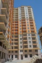 Facade of modern multi-storey new residential orange building near BAku . New apartment house . Storey houses modern . High rise Royalty Free Stock Photo