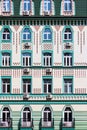 Facade of a modern multistory building in classical style close-up Royalty Free Stock Photo