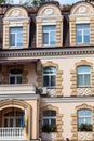 Facade of modern multistory building in classical style close-up Royalty Free Stock Photo