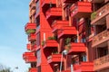 Facade of a modern red apartment house with many balconies Royalty Free Stock Photo