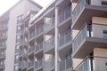 Facade of modern residential apartment building with glass balconies in sunlight Royalty Free Stock Photo