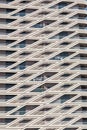 Facade of modern residential building.Balconies and windows of apartment building with diagonal architectural elements.