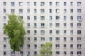 The facade of a multi-storey residential building. Many windows