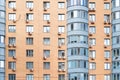 Facade of a multistorey residential building with installed air conditioners Royalty Free Stock Photo