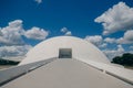 Facade of the National Museum of the Republic agaisnt a blue cloudy sky in Brasilia, Brazil Royalty Free Stock Photo