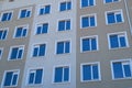 Facade of a new multi-storey building with many windows Royalty Free Stock Photo