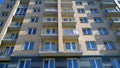 Facade of new multi-story residential building. Windows and balconies. House Share. Real estate investing. Buy, sale, rental and i Royalty Free Stock Photo