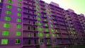 Facade of new residential building violet color. House Share. Real estate. Mortgage Interest Rates concept. Construction industry. Royalty Free Stock Photo