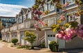 Facade of new residential townhouses with garages in Canada. Modern complex of apartment buildings in spring Royalty Free Stock Photo