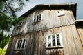 Facade of an old abandoned scary wooden house.