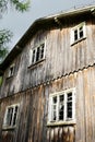 Facade of an old abandoned scary wooden house.