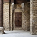 Facade of old abandoned stone bricks wall with grunge weathered wooden door, Cairo, Egypt Royalty Free Stock Photo