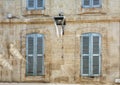 The facade of an old apartment building in the historic center of Avignon