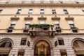 Facade of an old building with arches and stucco. Milan, Italy